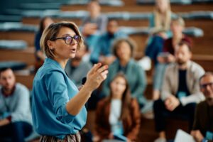 female-speaker-giving-a-presentation-during-business-seminar-at-convention-center-.jpg