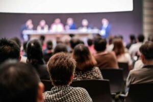 rear-view-of-audience-in-the-conference-hall-or-seminar-meeting-which-have-speakers.jpg